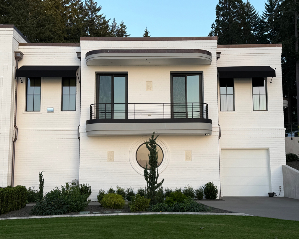Architectural fixed awnings over windows on a modern residence