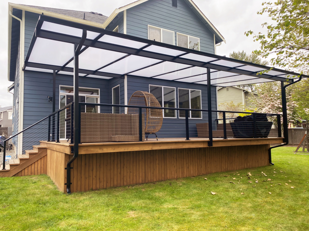 Custom fixed canopy covering a furnished residential deck