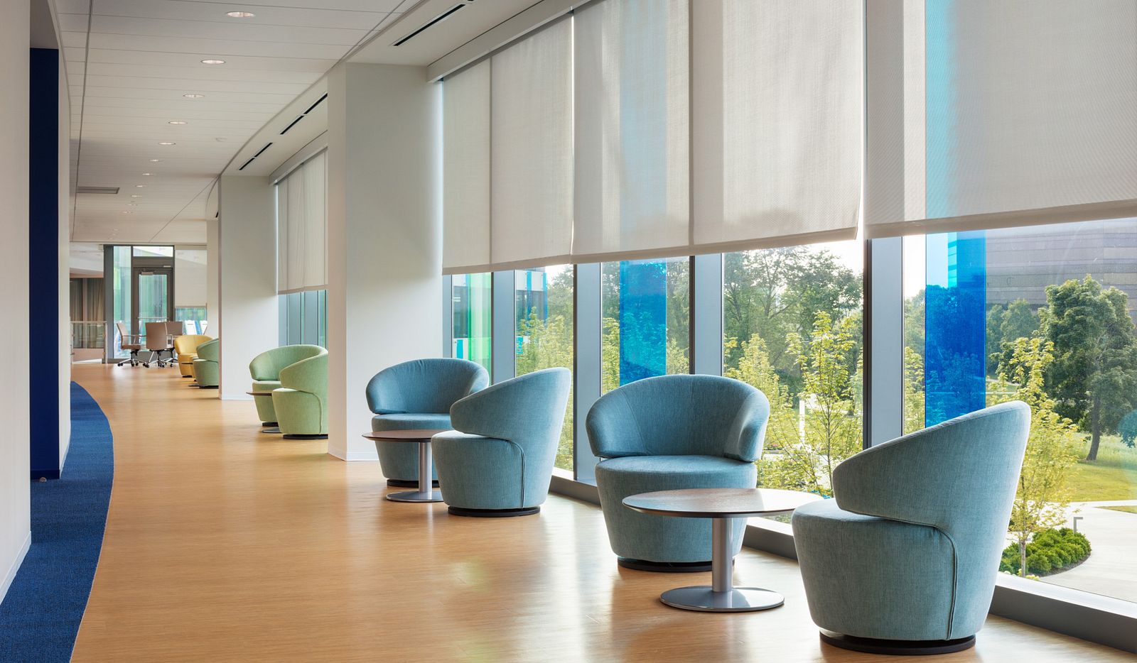 Commercial interior with coordinated solar roller shades