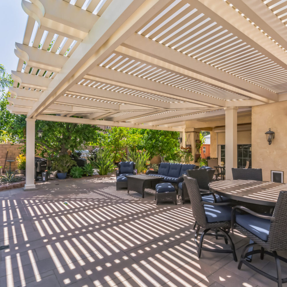 Residential aluminum patio cover creating a shaded outdoor living space
